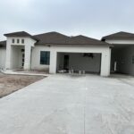 Beautiful newly built light texture stucco cement finish.