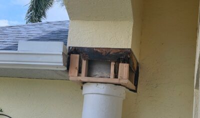 Florida stucco column repair showing damaged framing, wire lath, and corner bead