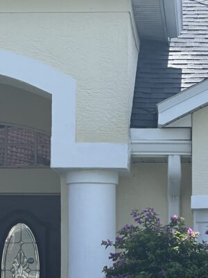 Completed stucco repair around exterior column on Florida home